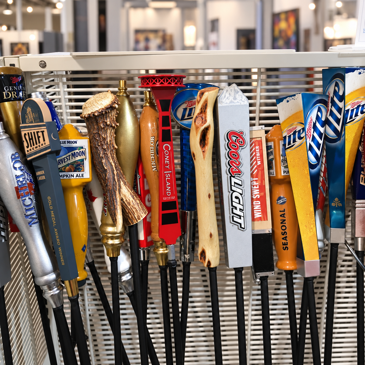 Beer-tap, deer-antler and Diamond Willow fire pokers displayed together.