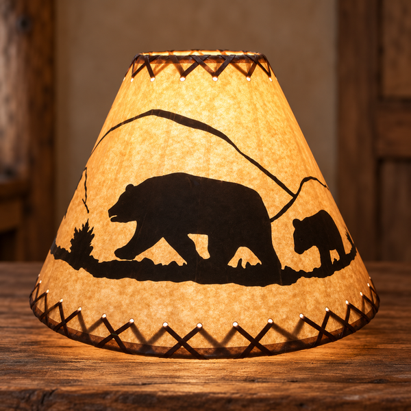Illuminated rustic bear and cub lamp shade with pine tree silhouettes and brown laced trim