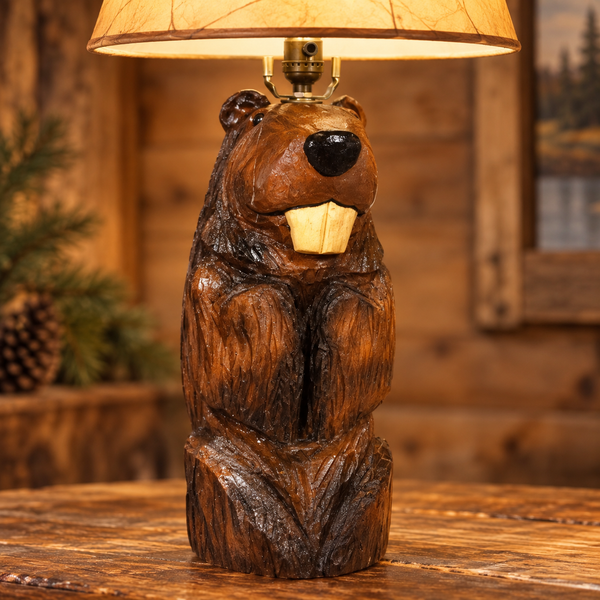 Close-up of the beaver lamp’s carved wood grain, glossy black nose, front teeth, paws and glowing log base