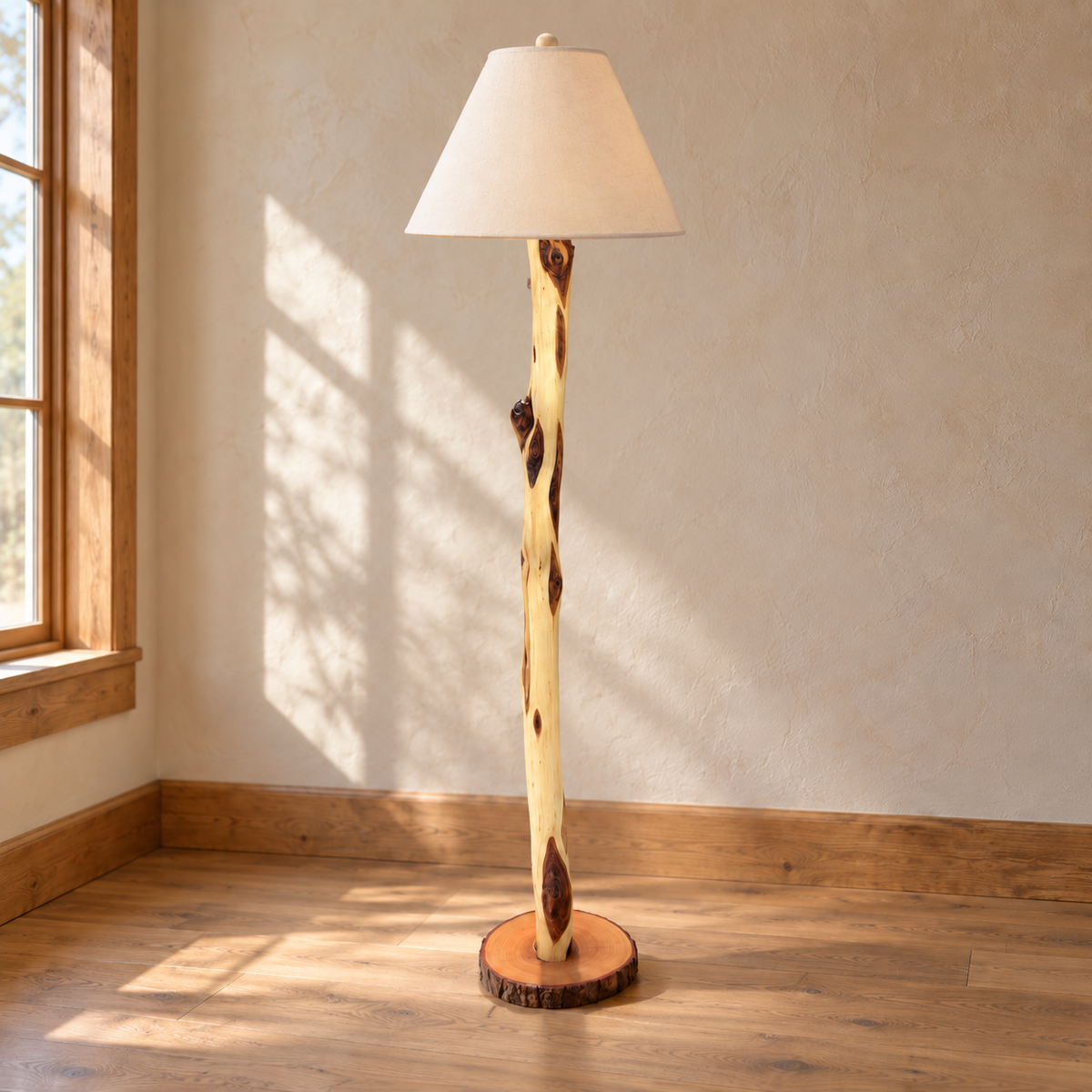 Custom Diamond Willow floor lamp with a cream shade and natural bark-edge wood base in a warm rustic interior.